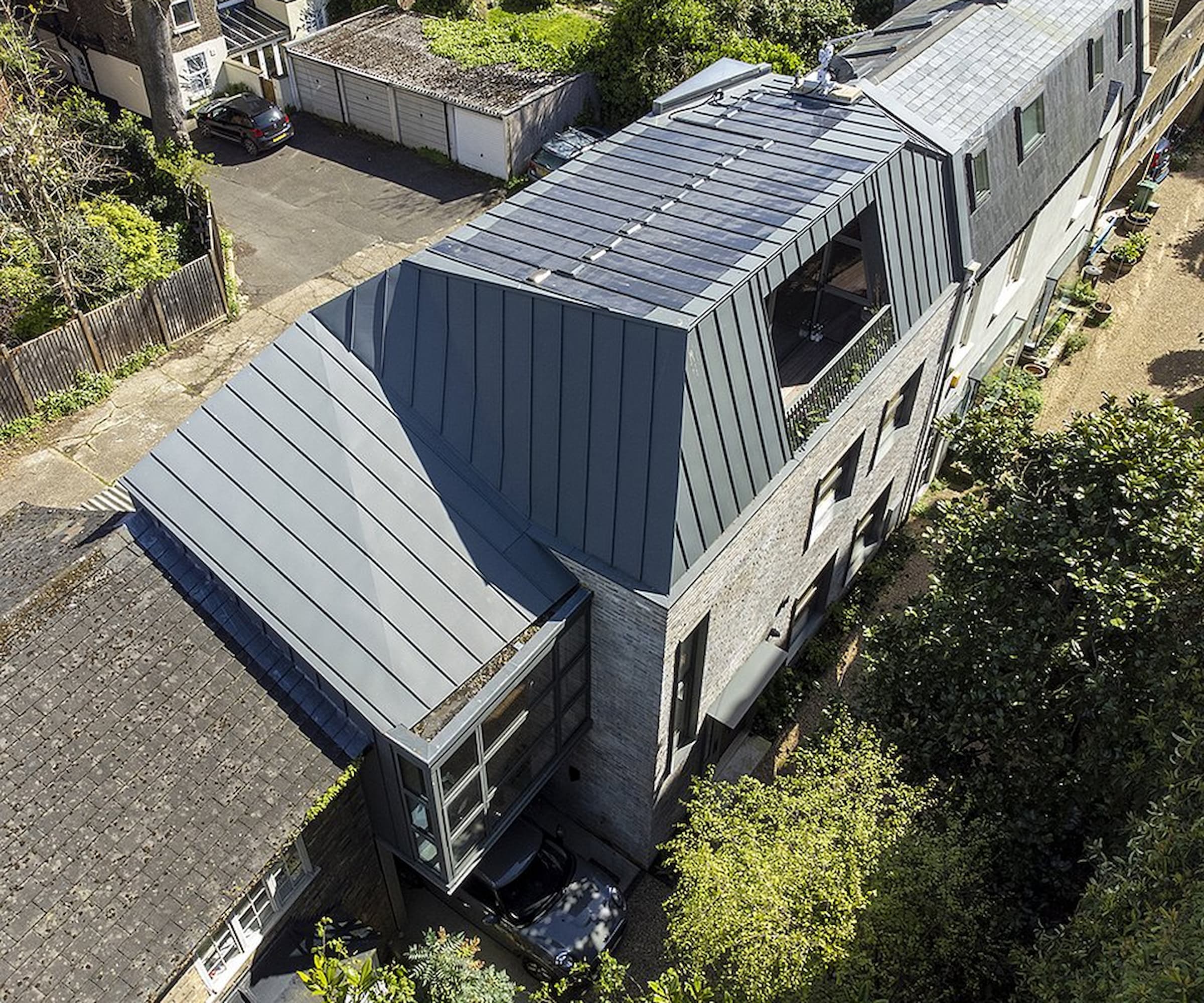 A third-floor extension to a townhouse with a roof terrace and skylight