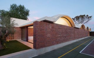The brick vaulted extension consists of two sets of quarters, separated by a bathroom block