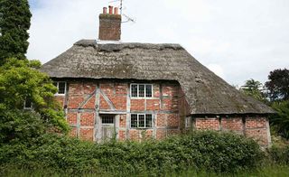Listed run-down medieval cottage