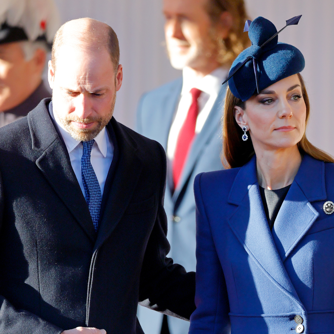 Prince William putting his hand on Princess Kate's back