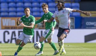 Josh Dacres-Cogley of Stockport County F.C. and Ibrahim Cissoko of Bolton Wanderers F.C. in action during the Sky Bet League One match between Bolton Wanderers and Stockport County