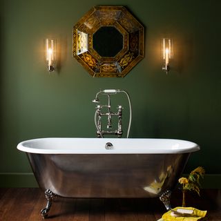 bathroom with green wall and bathtub