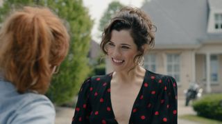 Becka greeting Evie in the street in The Couple Next Door episode 1