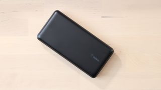 Belkin BoostCharge Power Bank 20K on a wooden surface