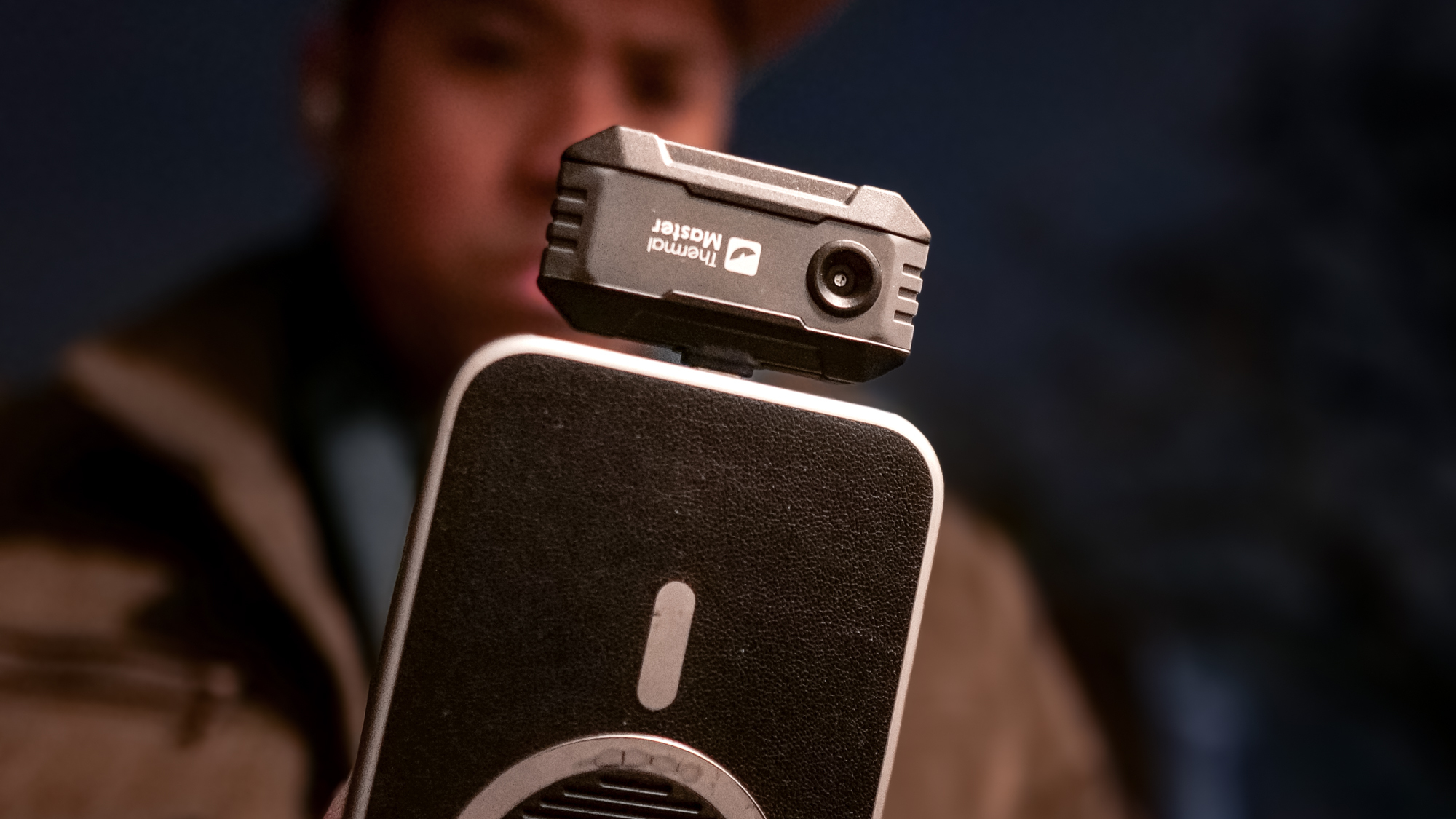 Thermal Master P1 attached to a phone.