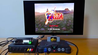 Nintendo 64 connected to monitor via OSCC and Sony transcoder with Zelda Ocarina of Time start screen displayed.