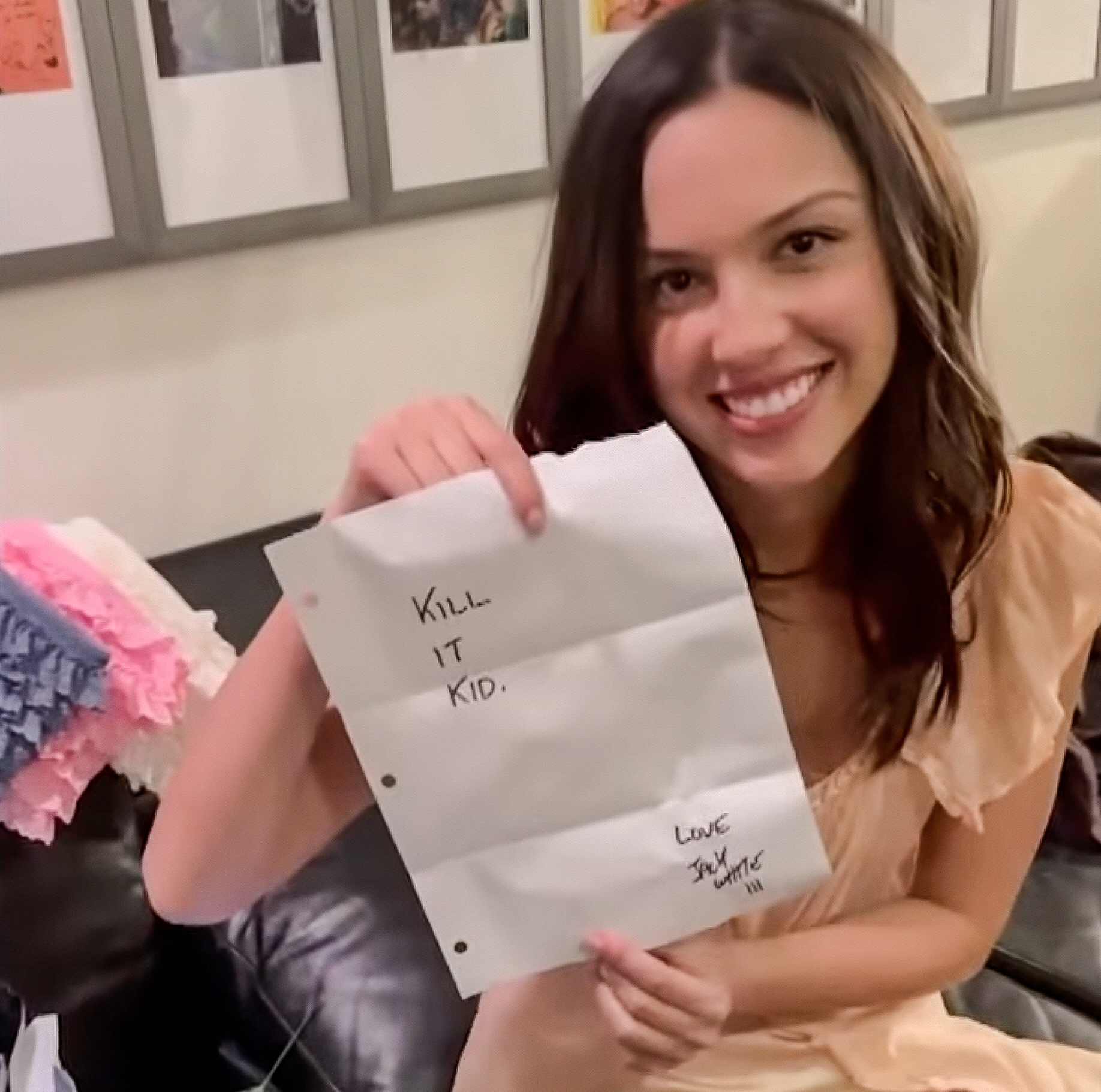 Olivia Rodrigo holds up the note Jack White left for her in her Saturday Night Live dressing room ahead of her appearance on the show on May 3, 2026