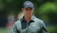 Rory McIlroy looks on as he walks on the green
