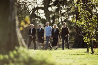 Michael Heseltine walking with his wife Anne and children Rupert, Alexandra and Annabel, at their country home in Thenford, taking a break during the Conservative party leadership battle in November 1990.