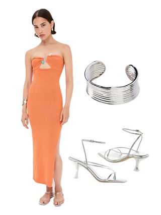 A woman wearing an orange dress, silver bracelet, silver high heels
