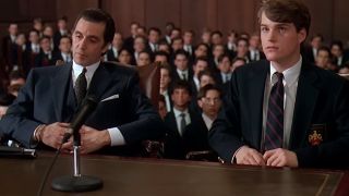 Al Pacino and Chris O'Donnell sitting at a table, wearing suits in Scent Of A Woman