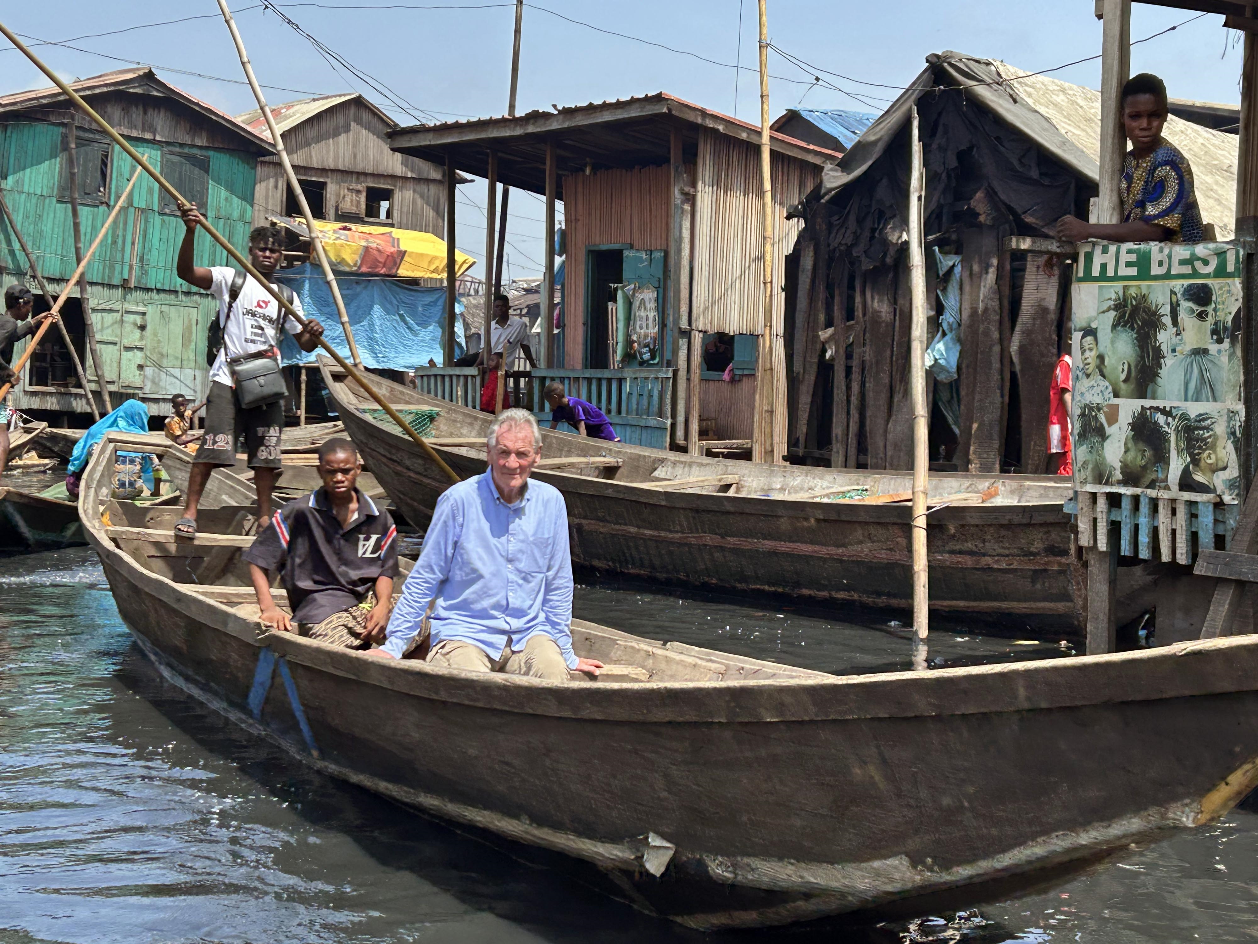 A boat journey in Michael Palin In Nigeria.
