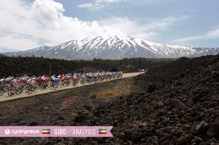 The peloton makes its way toward Mount Enta.