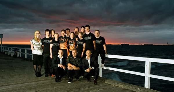 The team poses at a photo shoot