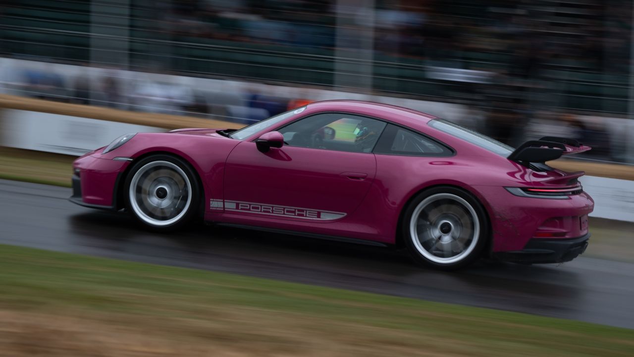 A car racing on as track at Goodwood