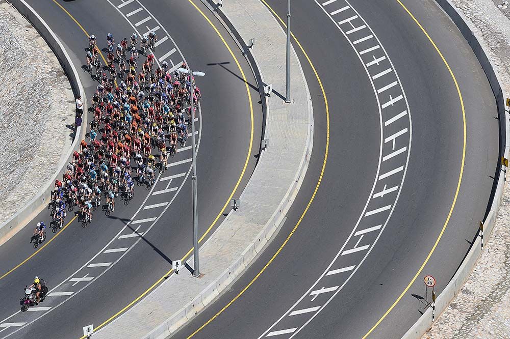 The peloton fills half of the highway