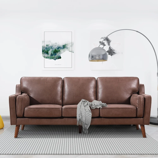 A brown leather deep seat sofa