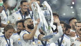 Karim Benzema of Real Madrid celebrate with the UEFA Champions League trophy