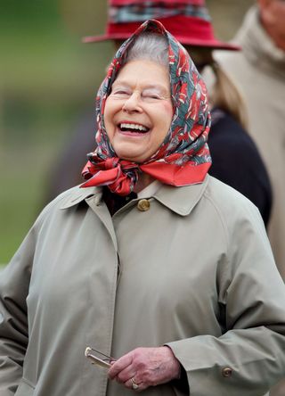 Queen Elizabeth laughing at the Royal Windsor Horse Show in Home Park on May 15, 2015 in Windsor, England