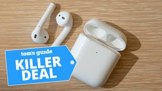 apple airpods 2 on wooden table with deal tag