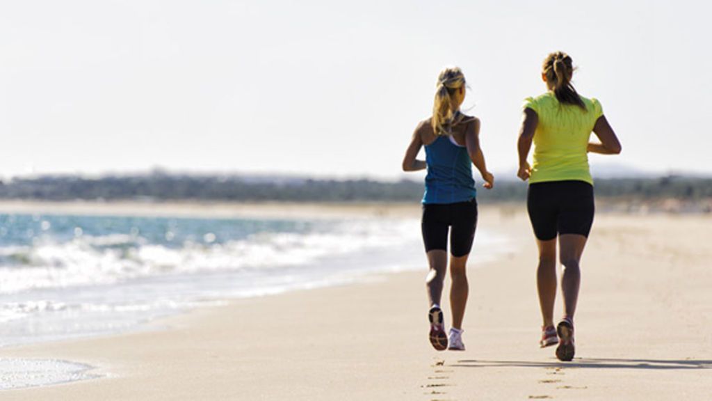 Woman jogging on beach