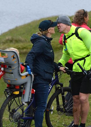 Zara and Mike Tindall kiss as he takes part in a Quadrathlon