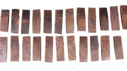 Wooden slips marked with Chinese characters that relate to the traditional Tiangan Dizhi astronomical calendar.