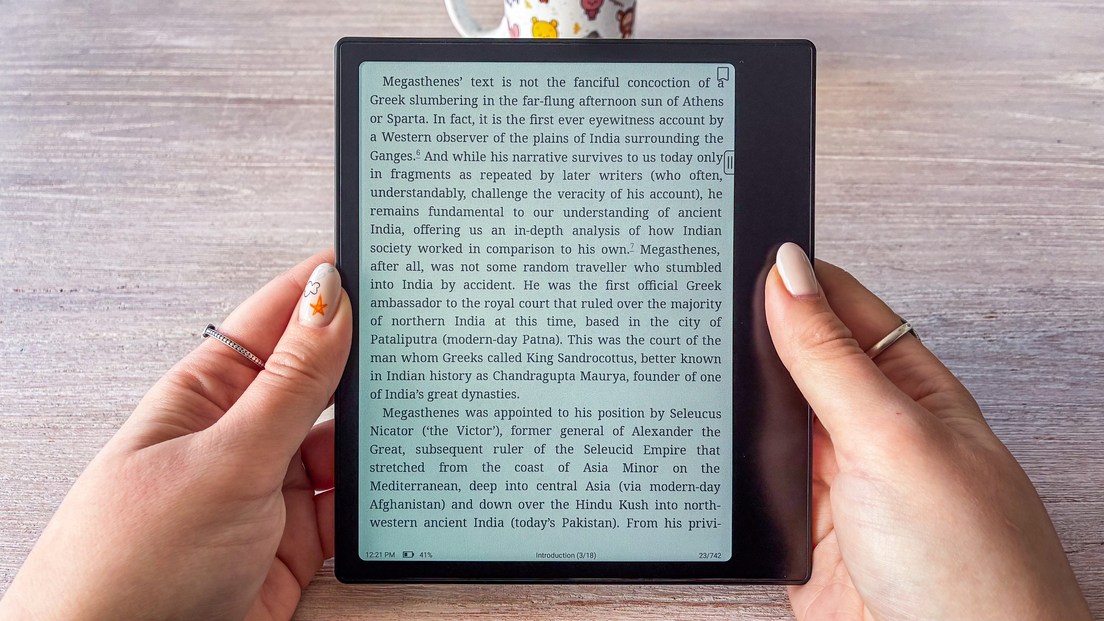A person holding the Boox Go Color 7 Gen II ereader