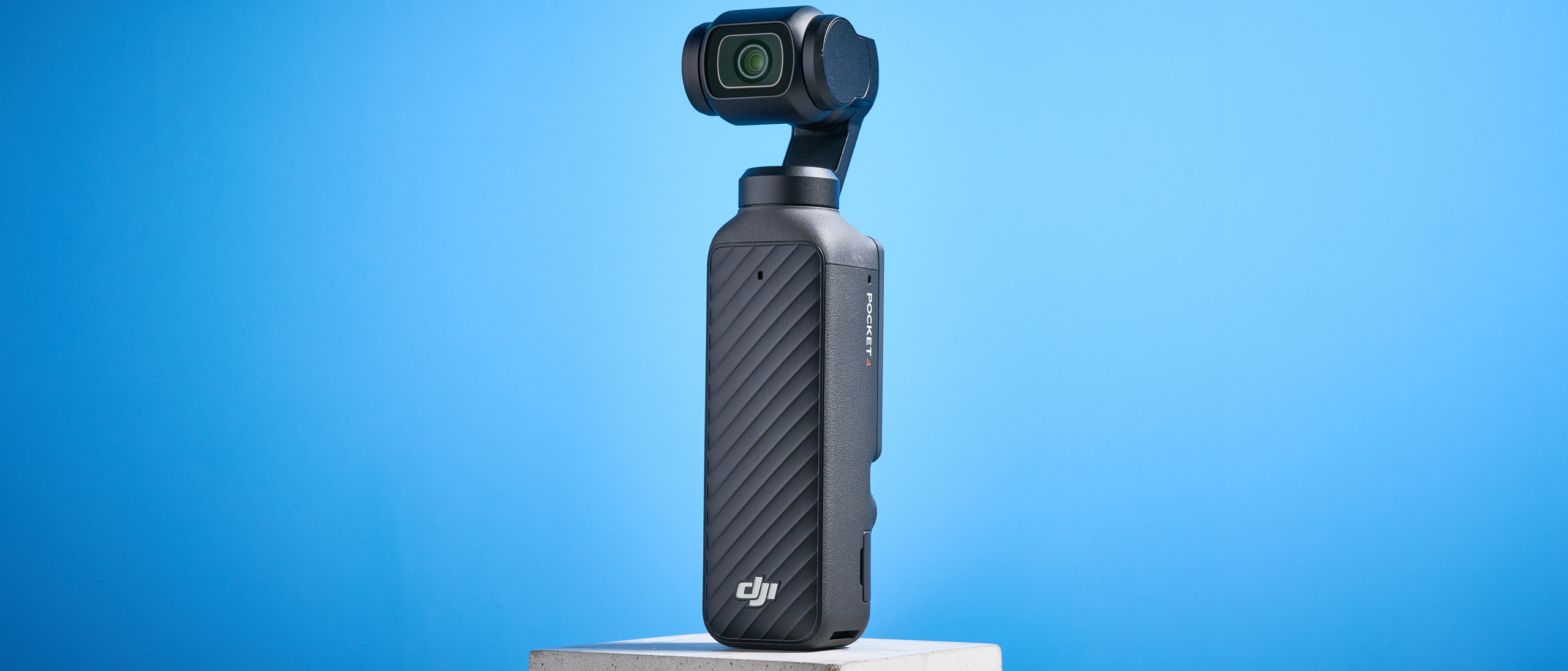 DJI Osmo Pocket 4 against a blue background