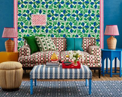 colourful living room with patterned wallpaper, ottoman and sofa