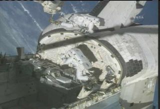 Spacewalkers Test Shuttle Heat Shield Repair Technique