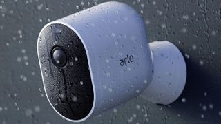 Arlo Pro 3 Camera mounted on wall outside in the rain