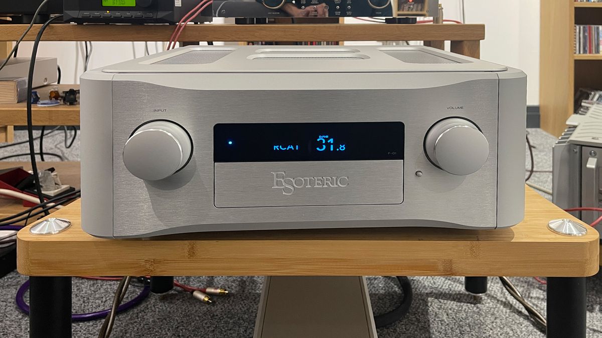 Esoteric F-01 stereo amplifier on wooden hi-fi rack with PS-01F power supply unit below