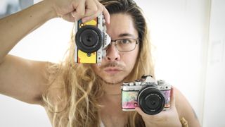 James Artaius holding a pair of Nikon Z fc Heralbony edition cameras