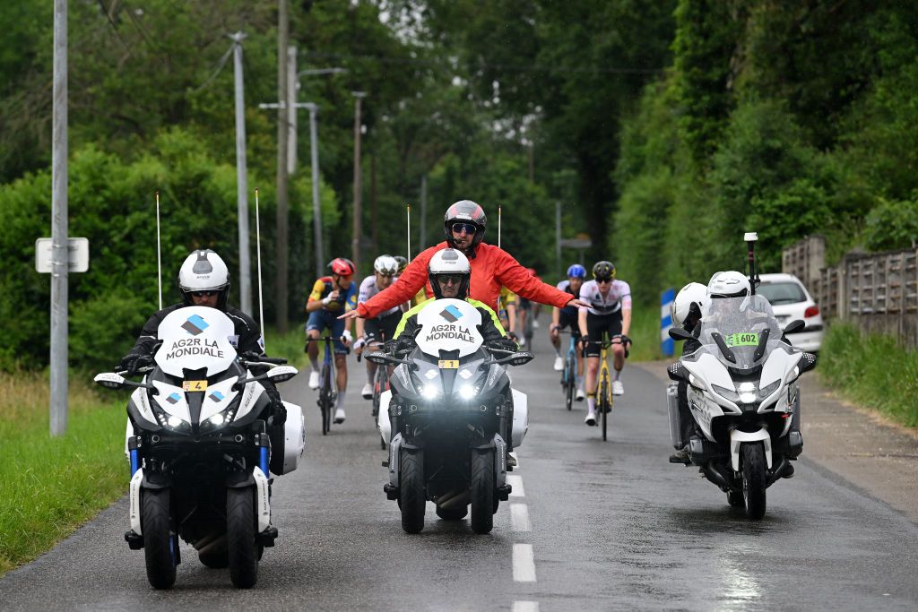 BOISSETSAINTPRIEST FRANCE JUNE 06 A general view the race regulator neutralization of the race due to a multiple fall during the 76th Criterium du Dauphine 2024 Stage 5 a 167km stage from Amplepuis to SaintPriest UCIWT on June 06 2024 in BoissetSaintPriest France Photo by Dario BelingheriGetty Images