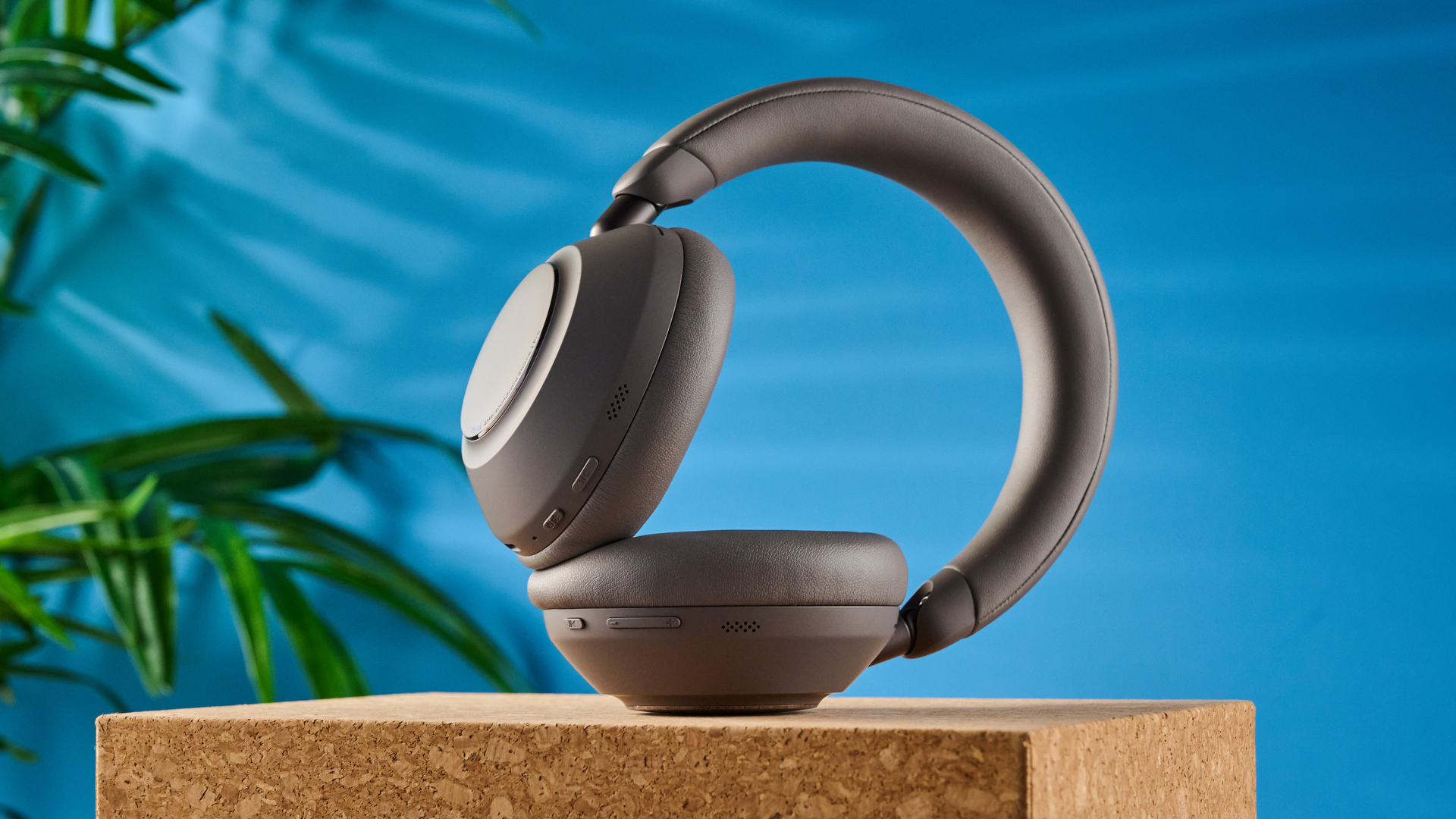 the anker soundcore space 2 pro headphones in mauve gray photographed against a blue tom's guide background