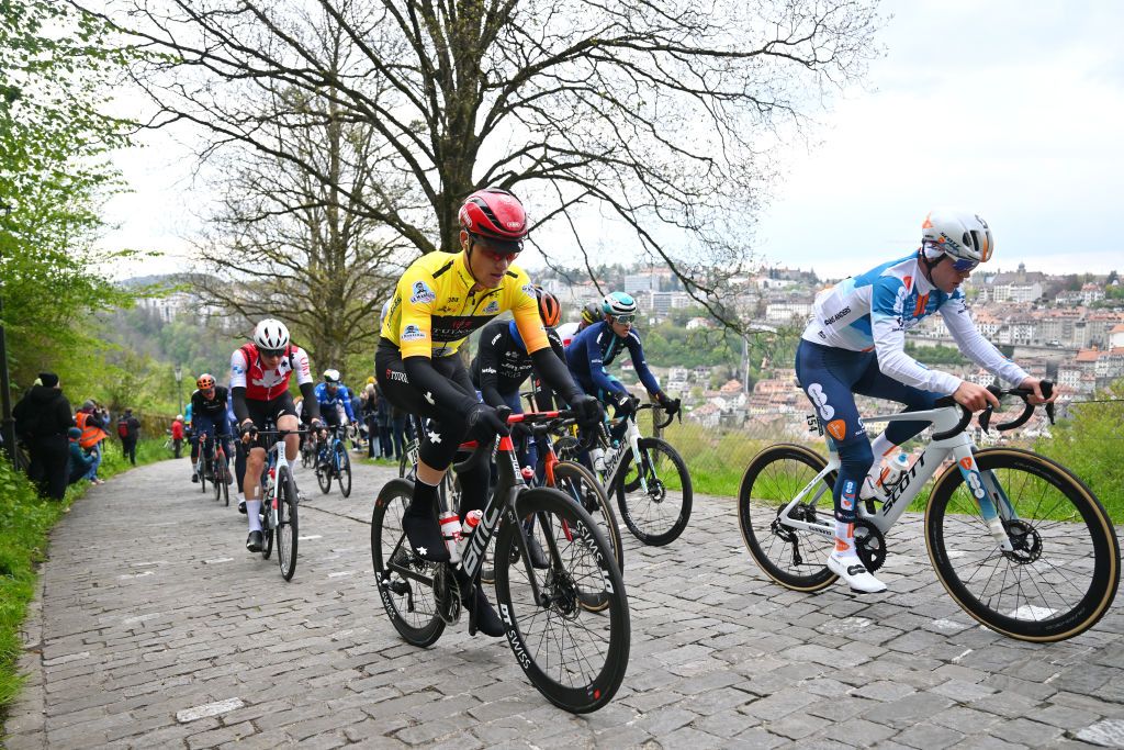 FRIBOURG SWITZERLAND APRIL 24 LR Maikel Zijlaard of The Netherlands and Tudor Pro Cycling Team Yellow Leader Jersey and Sean Flynn of The United Kingdom and Team dsmfirmenich PostNL compete during the 77th Tour De Romandie 2024 Stage 1 a 1657km stage from Chateau dOex to Fribourg UCIWT on April 24 2024 in Fribourg Switzerland Photo by Luc ClaessenGetty Images