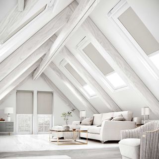 loft conversion white living room with cream sofa and white flooring