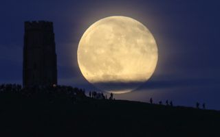 Full moon over Glastonbury Tor, UK, shot with a 1000mm lens 