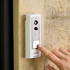 Finger pressing aldi video doorbell