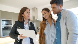 Real estate agent with clients