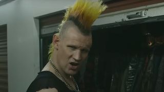 Matt Smith with a big orange and yellow punk mohawk as Russ in Caught Stealing.