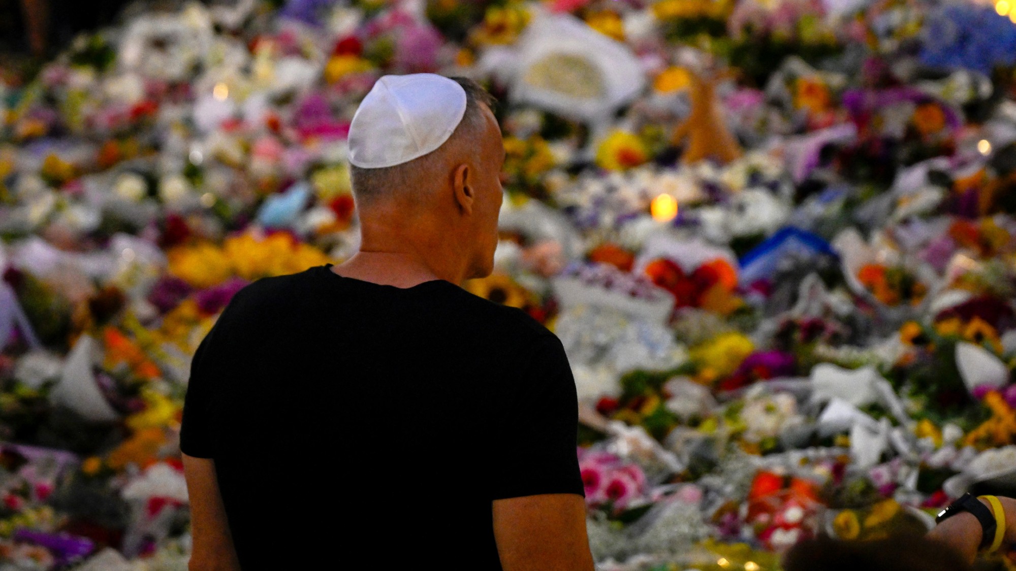 A mourner at the Bondi Pavilion, where people have been paying tribute to the victims of a mass shooting at Bondi Beach 