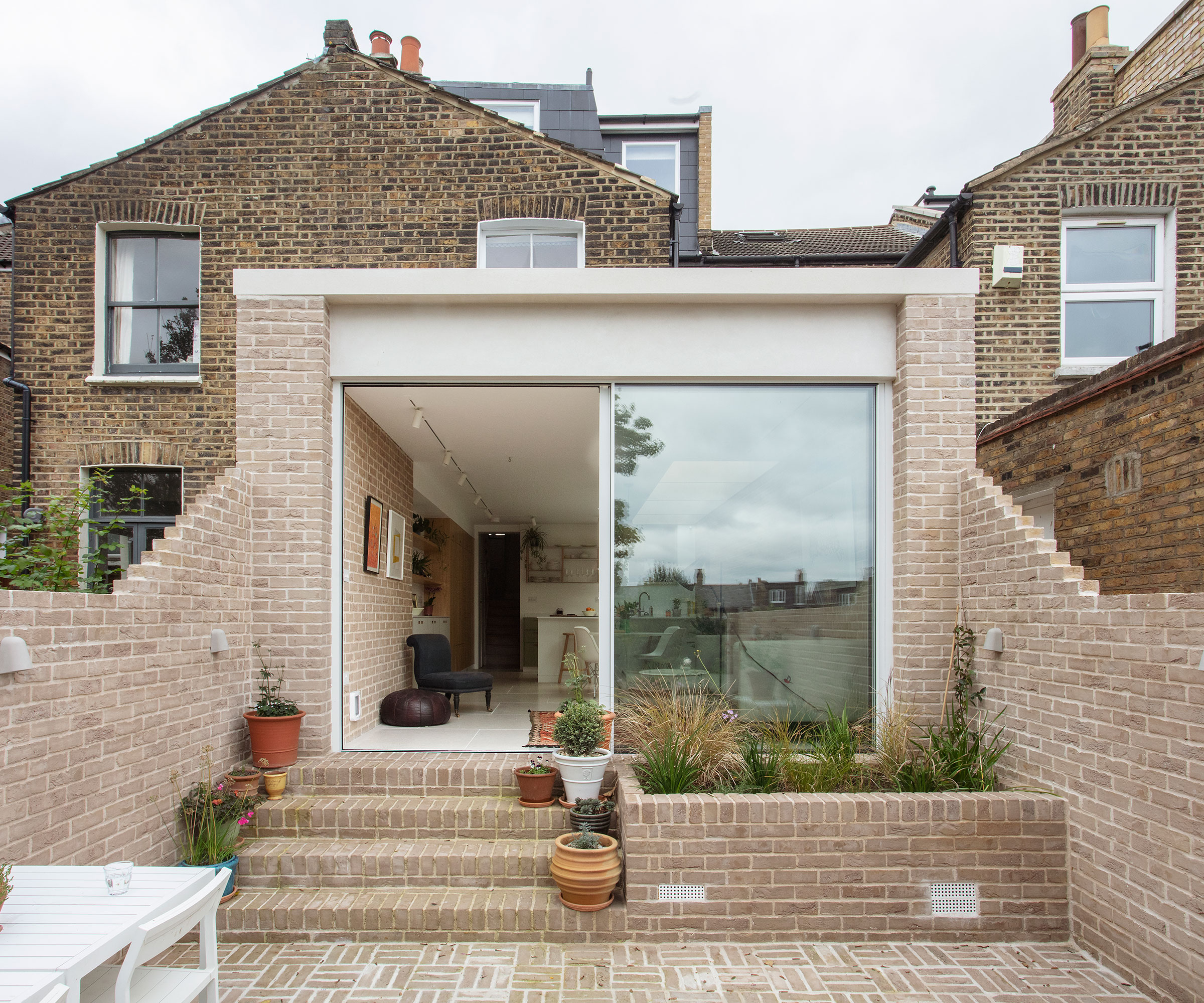 single storey flat roof kitchen extension with sliding doors