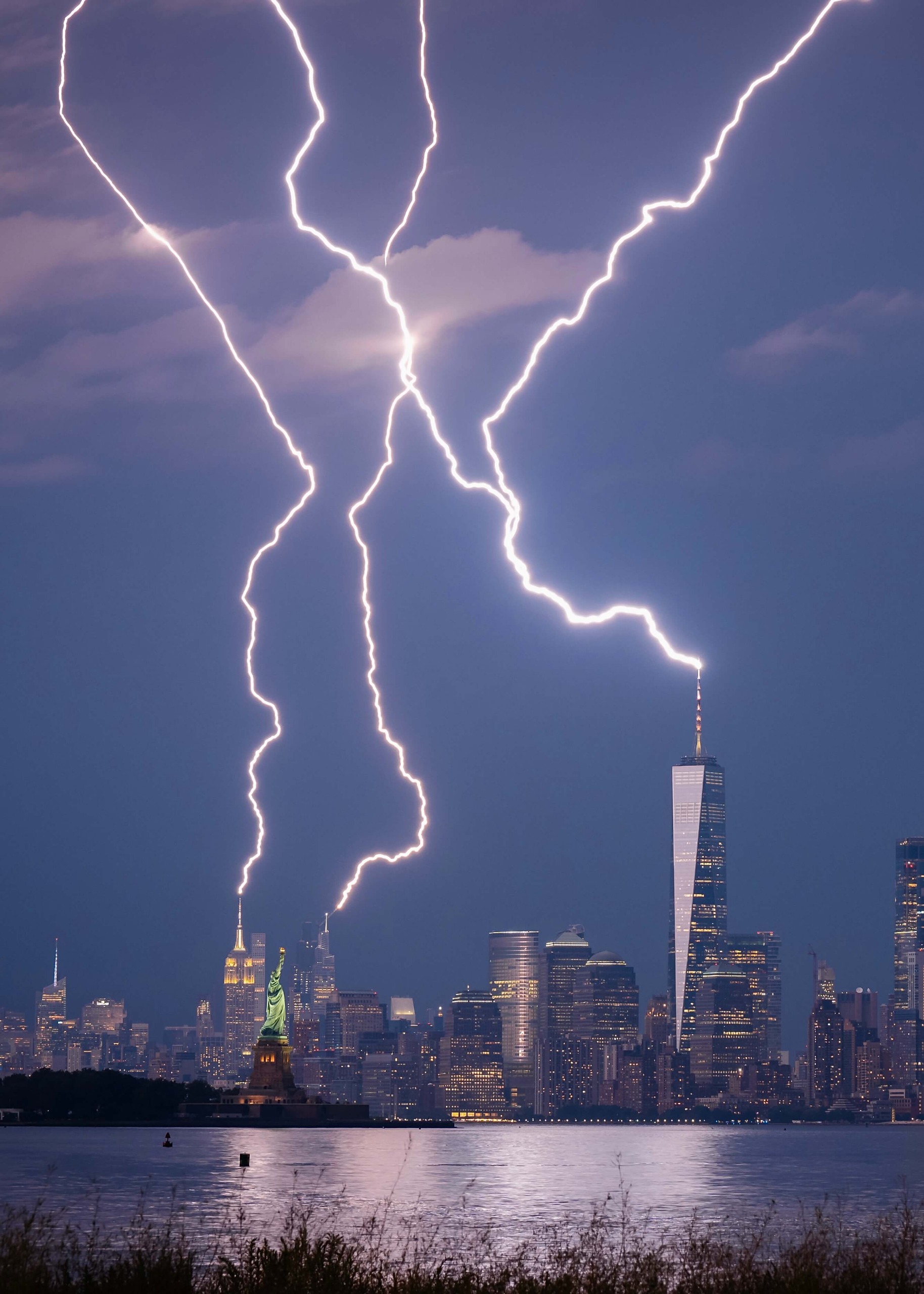 Lighting strikes the One World Trade Center tower in New York City.