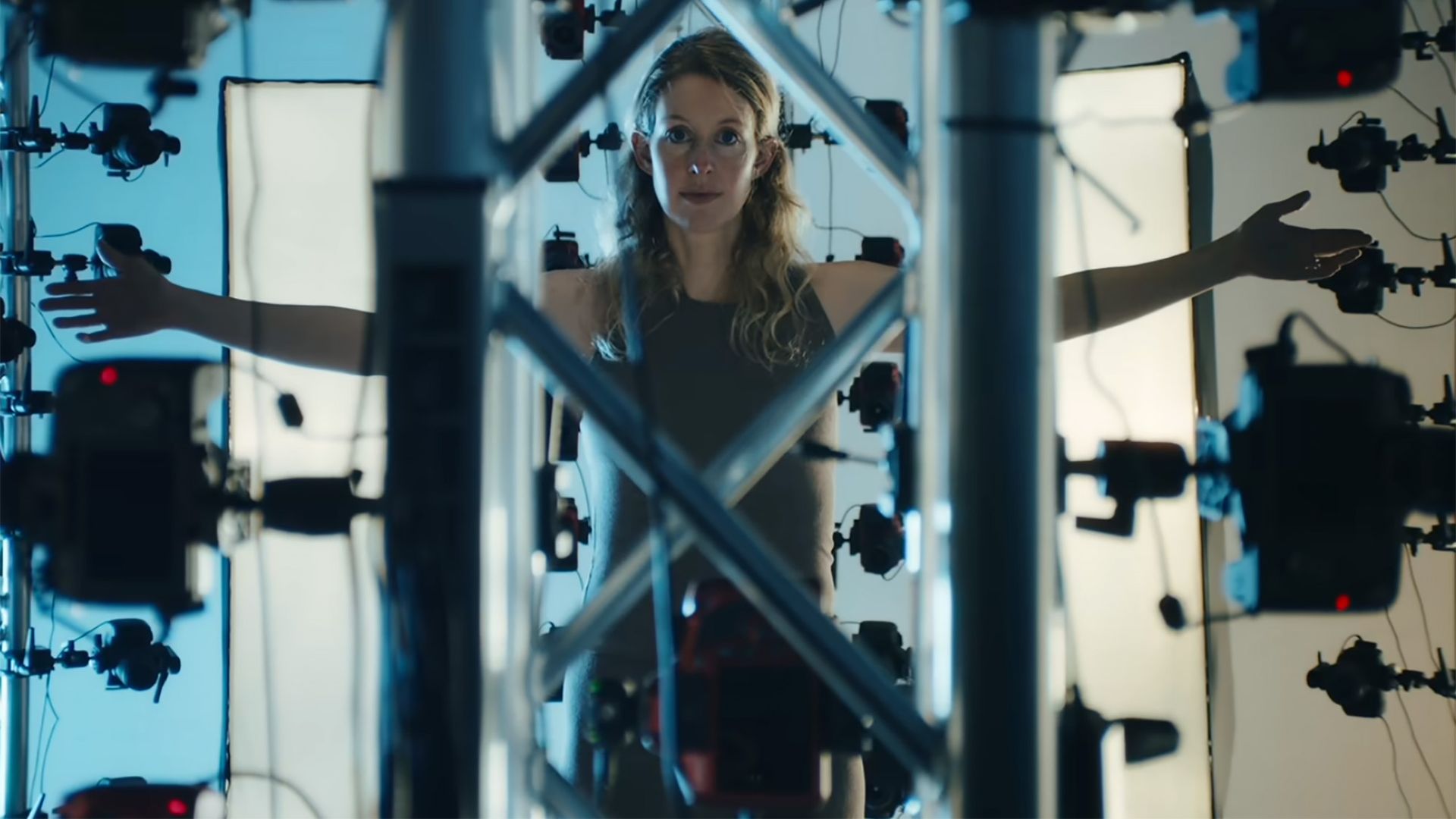 A look at Elizabeth Holmes getting her body scanned for AI before heading to prison in You Can See Everything.