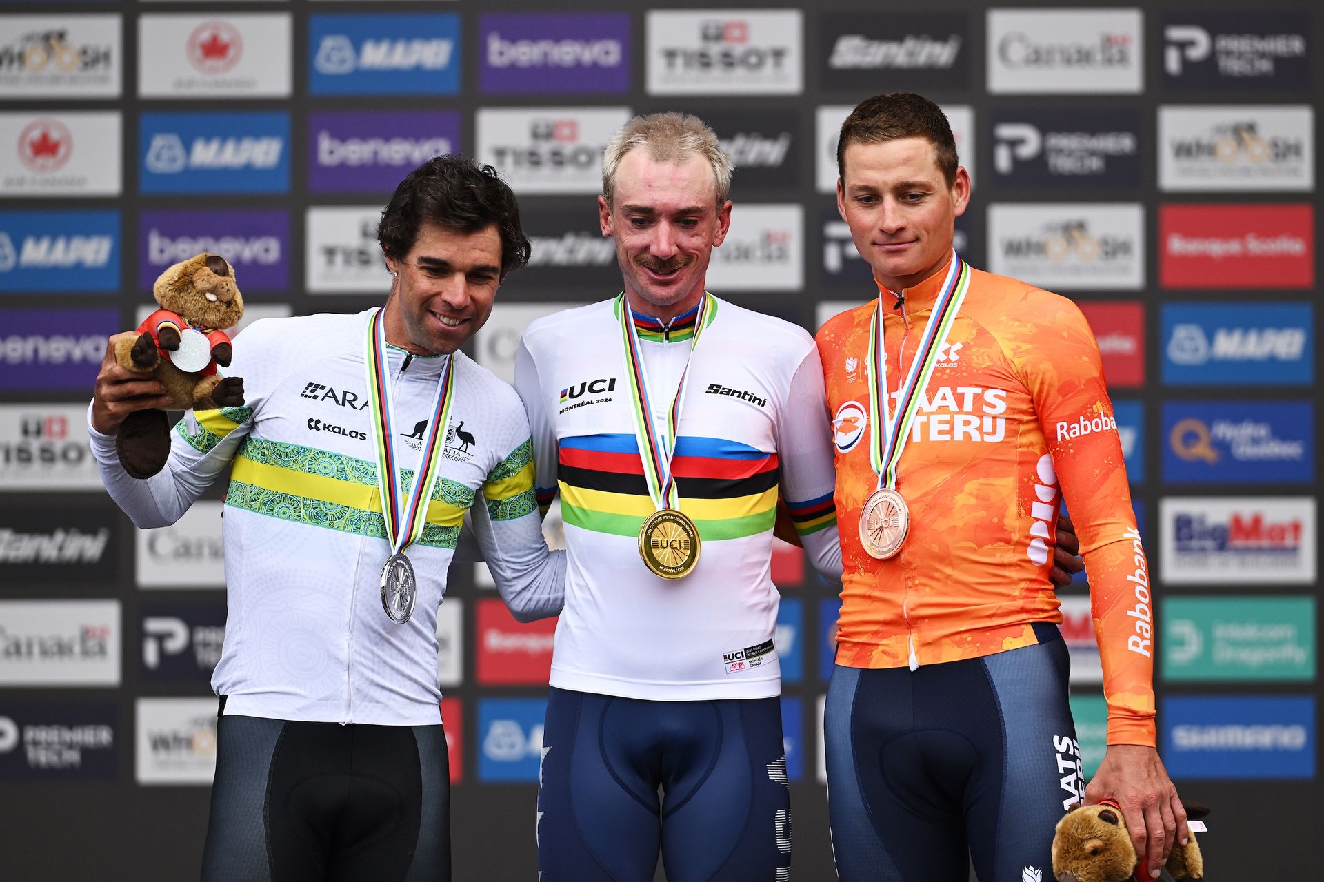 Silver medalist Michael Matthews, gold medalist Brandon McNulty and bronze medalist Mathieu Van Der Poel pose on the podium at the UCI Road World Championships Montreal 2026