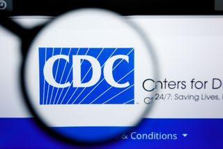 A magnifying glass over CDC's logo online.