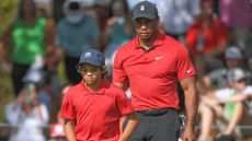 Tiger Woods watches on with son Charlie Woods