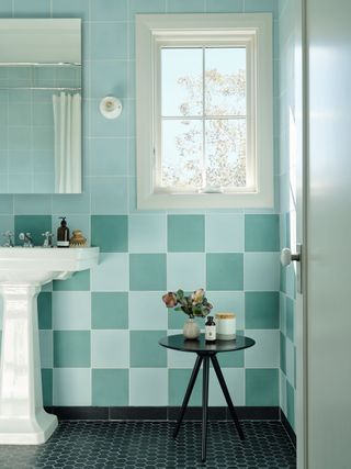 light blue and green tiled bathroom in a checkerboard design